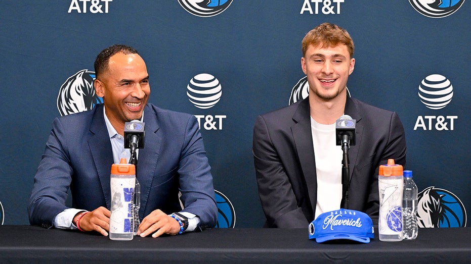 Nico Harrison and Cooper Flagg react