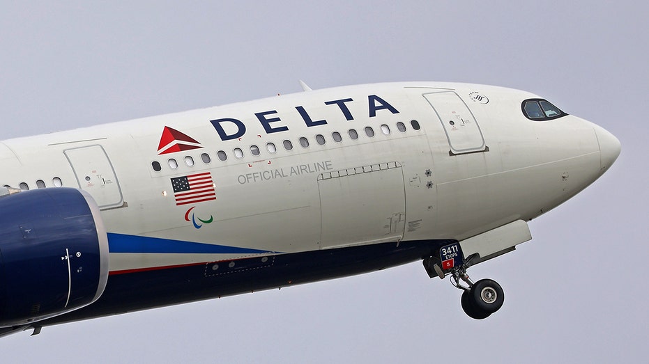 Delta plane climbing cloudy skies