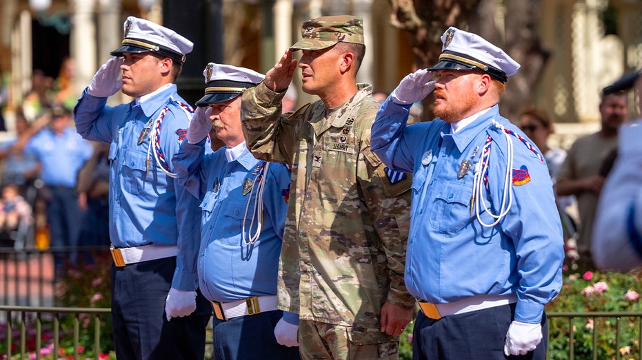 U.S. Army Col. Shawn Bault participates in a special Flag Retreat Ceremony at Disney World