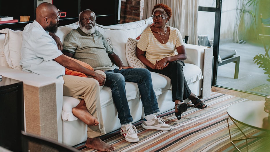 Adult family talking in the living room