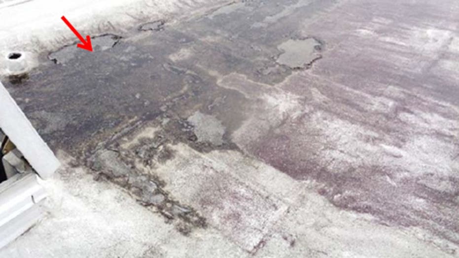 A photo showing a damaged roof at the Federal Reserve