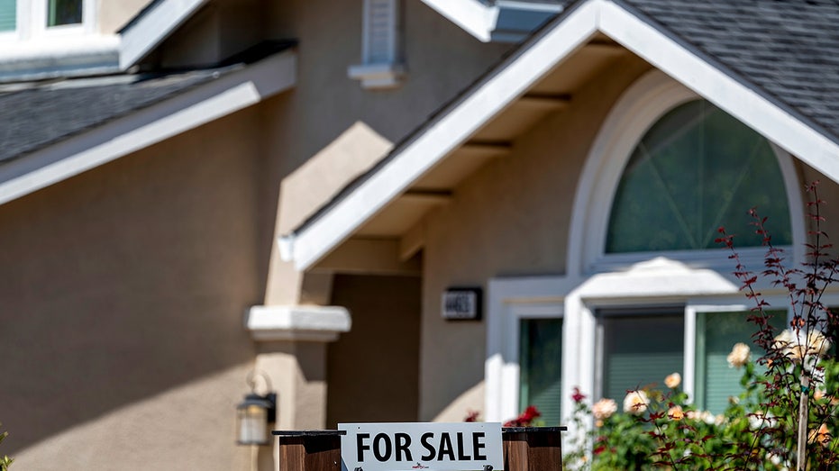 One "It is sold for" San Jose, California, sign in front of a house,