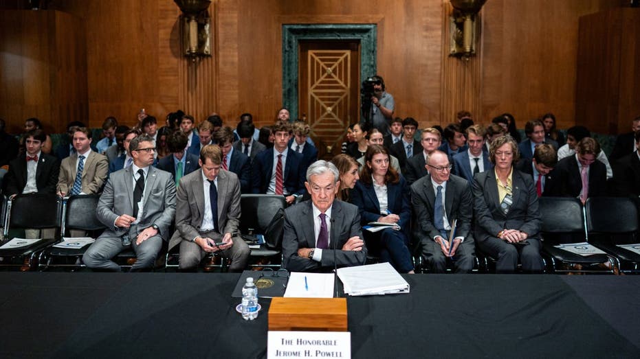 Federal Reserve Chairman Jerome Powell sits before Congress
