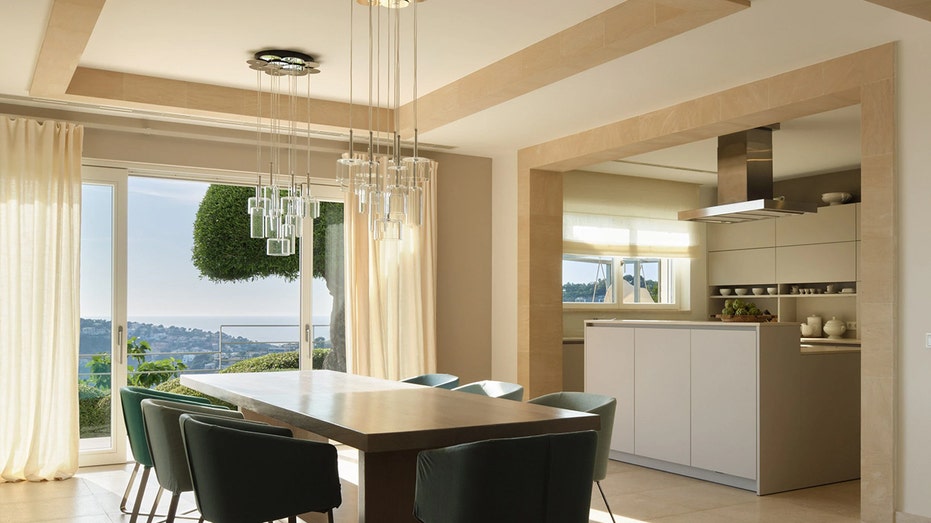 An open floorplan kitchen with the dining table placed near it.