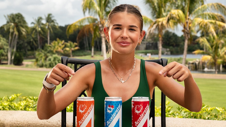 Kai Trump points to Accelerator cans