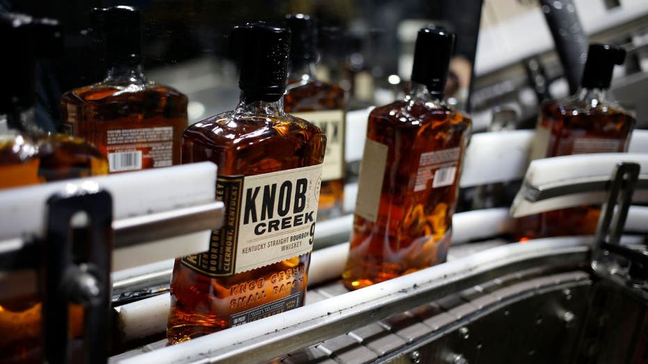Bottles of Knob Creek bourbon on a conveyor belt at a Kentucky distillery
