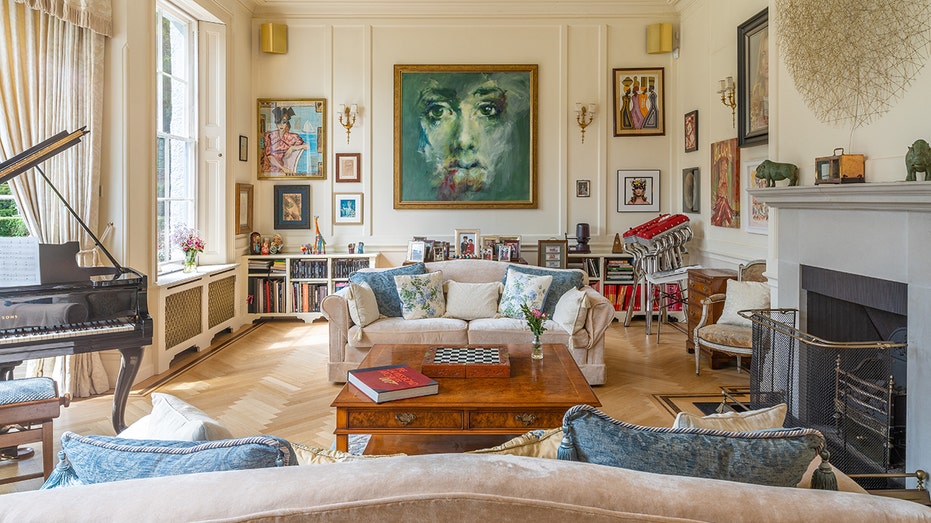 The family room features a gallery wall as well as a wood-burning fireplace.