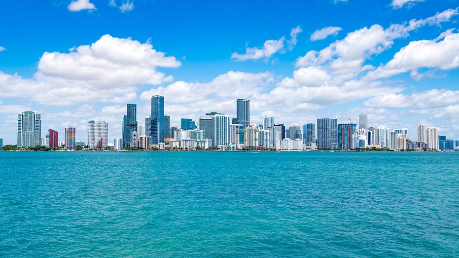 Miami skyline with blue sky and water