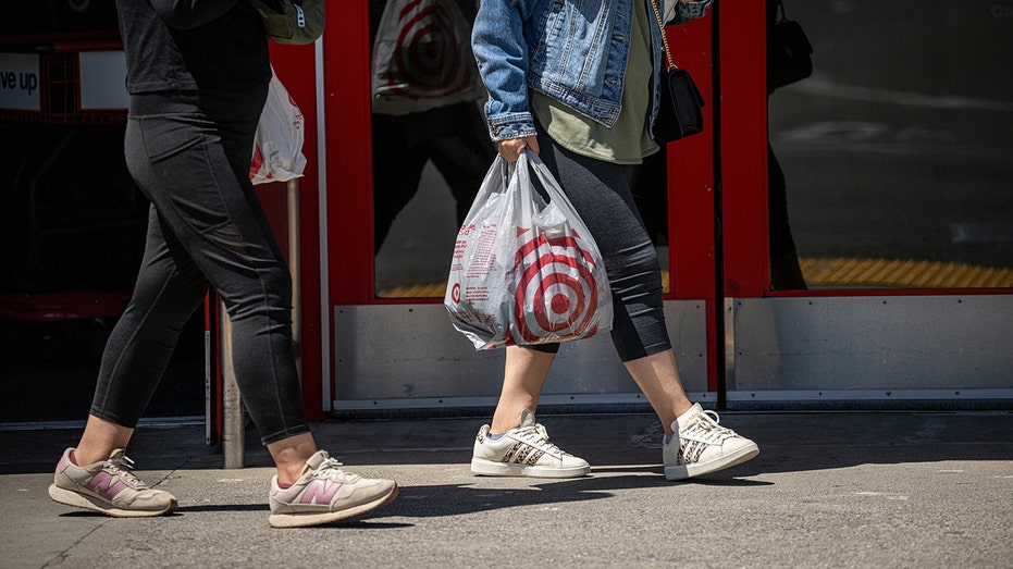 Target customers walk out with bags in hand