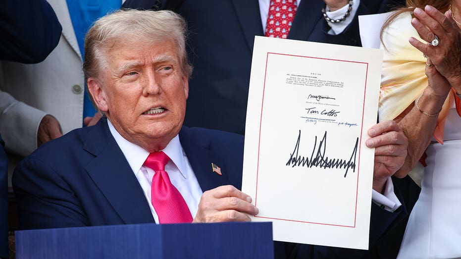 WASHINGTON, DC - JULY 04: U.S. President Donald Trump, joined by Republican lawmakers, signs the One, Big Beautiful Bill Act into law during an Independence Day military family picnic on the South Lawn of the White House on July 04, 2025 in Washington, DC. After weeks of negotiations with Republican holdouts Congress passed the One, Big Beautiful Bill Act into law, President Trump’s signature tax and spending bill. The bill makes permanent President Donald Trump’s 2017 tax cuts, increase spending on defense and immigration enforcement and temporarily cut taxes on tips, while cutting funding for Medicaid, food assistance and other social safety net programs. (Photo by Samuel Corum/Getty Images)