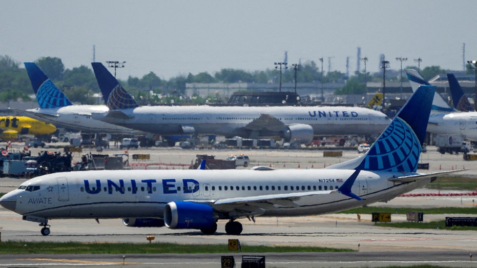 United Airlines plane taxis on the tarmac