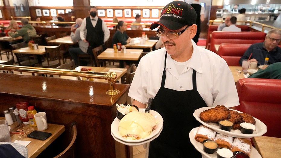 Restaurant worker serves food