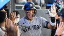 New York Yankees designated hitter Aaron Judge (99) celebrates with team mates in the dugout after hitting a two run home run against the Toronto Blue Jays in the sixth inning at Rogers Centre on July 23, 2025. - Fox Business News