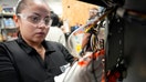 FILE - Dayret Alaniz works on the circuit board of a thermostat in the Clean Tech Accelerator program at Goodwill Job Connection, April 4, 2024, in Houston. - Fox Business News
