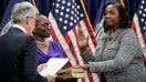 Chair of the Federal Reserve Jerome Powell (L) administers the oath of office to Lisa Cook (R) to serve as a member of the Board of Governors at the Federal Reserve System during a ceremony at the William McChesney Martin Jr. Building of the Federal Reserve May 23, 2022 in Washington, D.C. Cook becomes the first Black woman to serve as a governor on the Federal Reserve Board.  - Fox Business News
