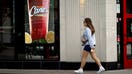 CHICAGO, ILLINOIS - JUNE 30: A pedestrian walks by a Raising Cane's restaurant on June 30, 2025 in Chicago, Illinois. Raising Cane’s overtook KFC to become the nation's third-largest chicken chain behind Chick-fil-A and Popeyes. (Photo by Scott Olson/Getty Images) - Fox Business News