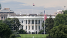 A large flag is seen after a flag raising ceremony for the newly installed flagpole on the South Lawn of the White House on June 18, 2025 in Washington, D.C. - Fox Business News