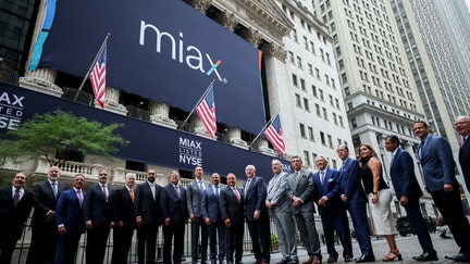 Thomas Gallagher, chairman and chief executive officer of Miami International Holdings (MIAX), center, during the company's initial public offering (IPO) at the New York Stock Exchange (NYSE) in New York, US, on Thursday, Aug. 14, 2025.  - Fox Business News