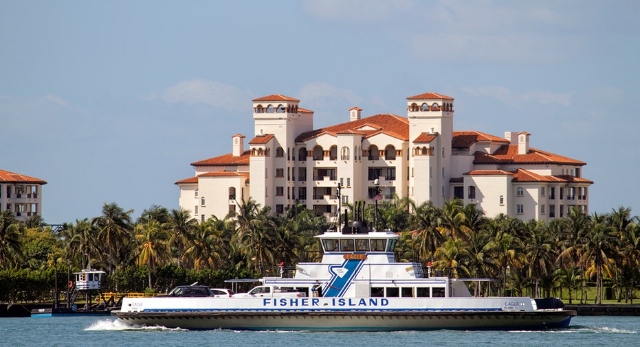 Fisher Island ferry passing condo building