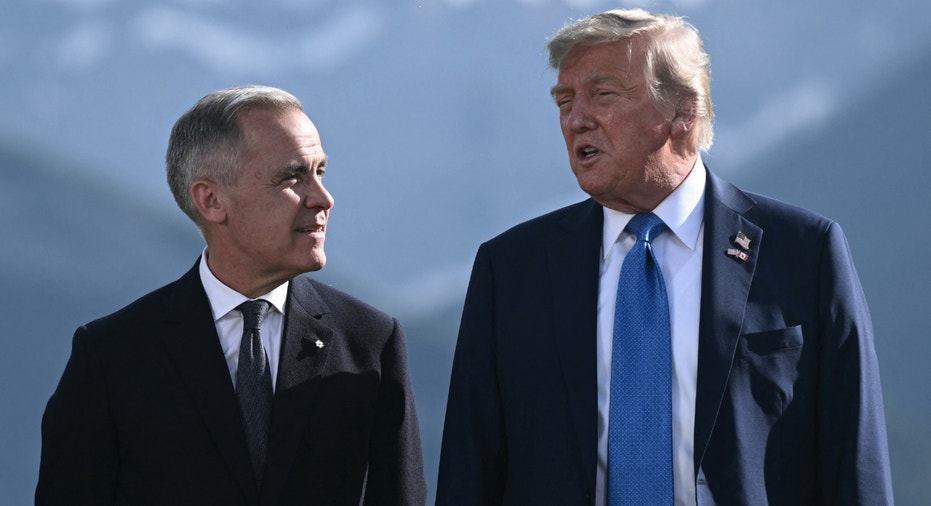 Canadian Prime Minister Mark Carney (L) and President Donald Trump pose for a photo during the G7 Summit at the Kananaskis Country Golf Course in Kananaskis, Alberta, Canada on June 16, 2025.