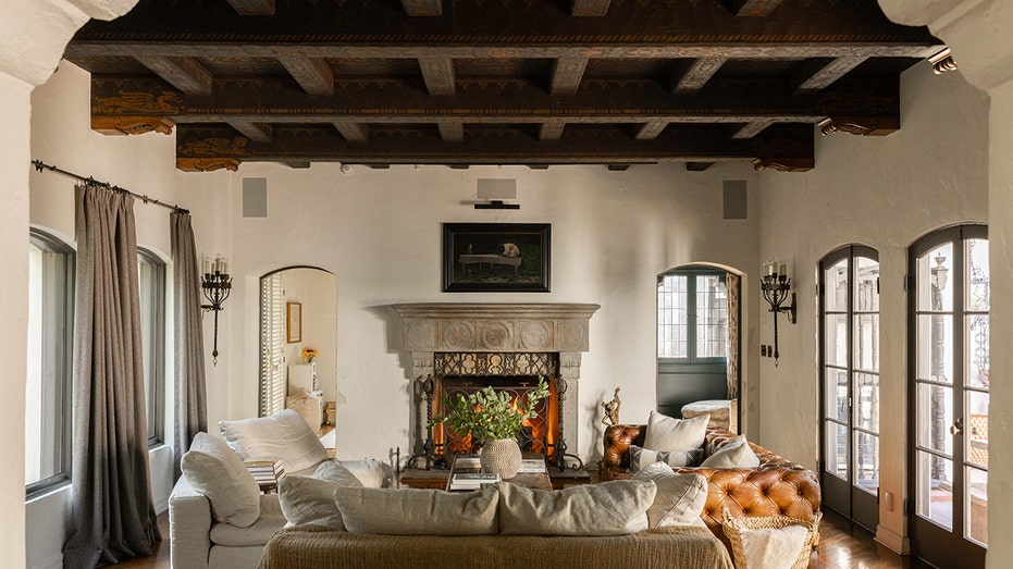 The living room still features the original wood beams.