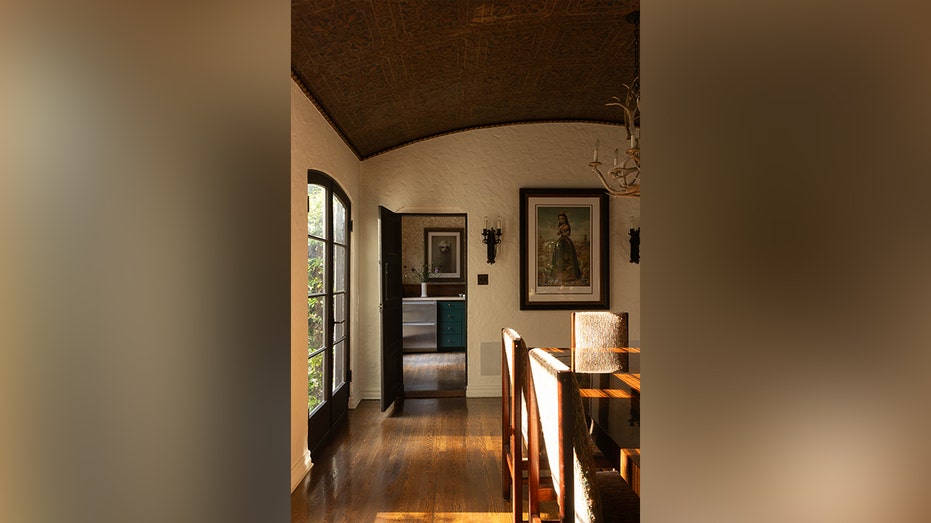 The dining room leads to the kitchen.