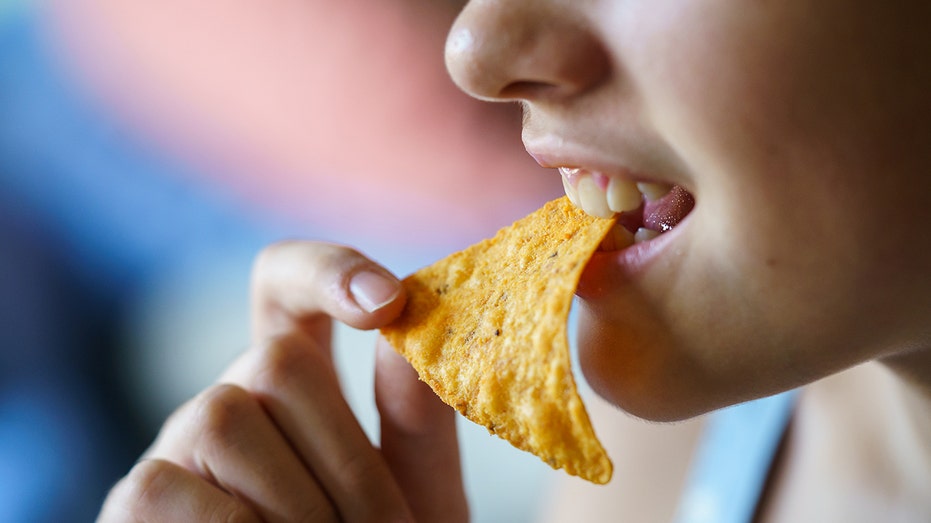 Person eating chips