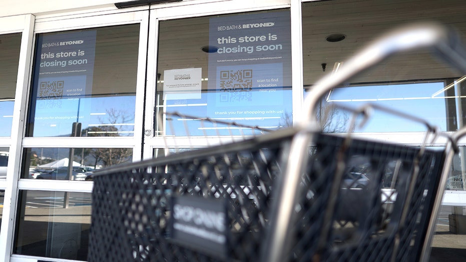 A closing sign in front of a Bed Bath & Beyond store in California