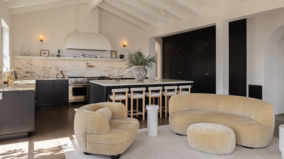 The kitchen features a large center eat-in island.