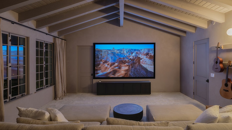 The home also features a screening room with a large television.