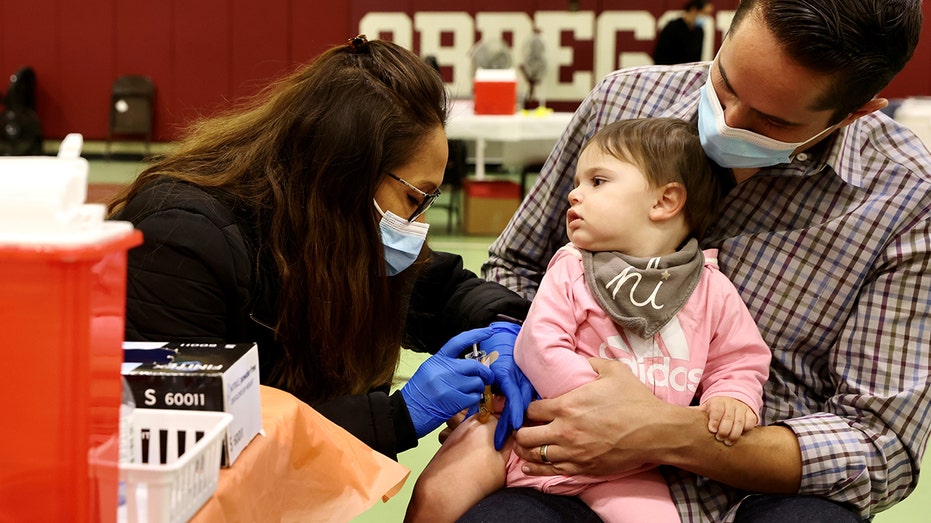 Child receives covid vaccine in 2022