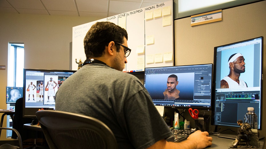 The sports employee is working on a game