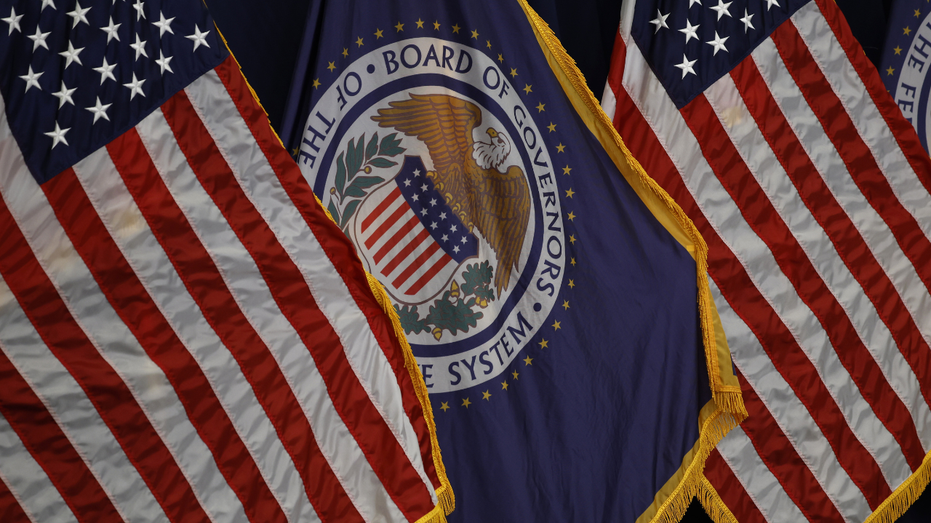 A view of the U.S. flag and the Board of Governors of the Federal Reserve flag