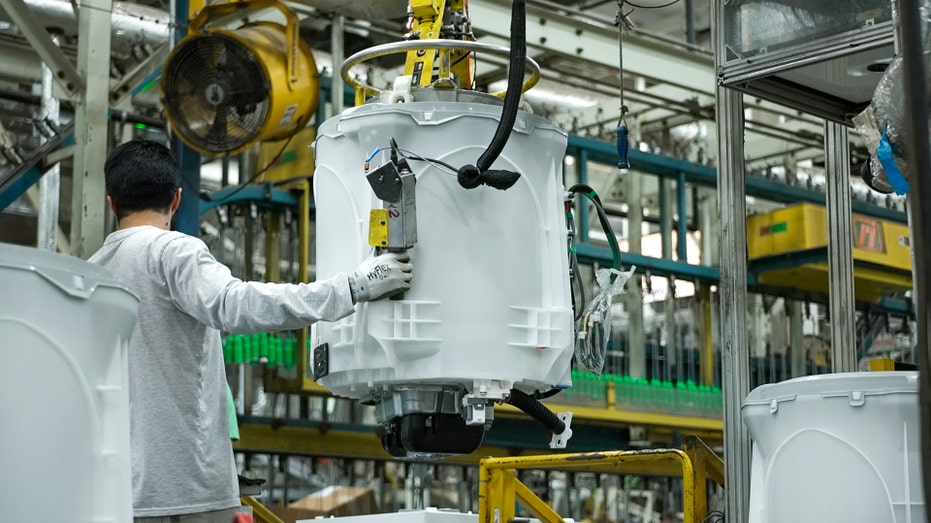 Someone working at one of GE Appliances manufacturing facilities