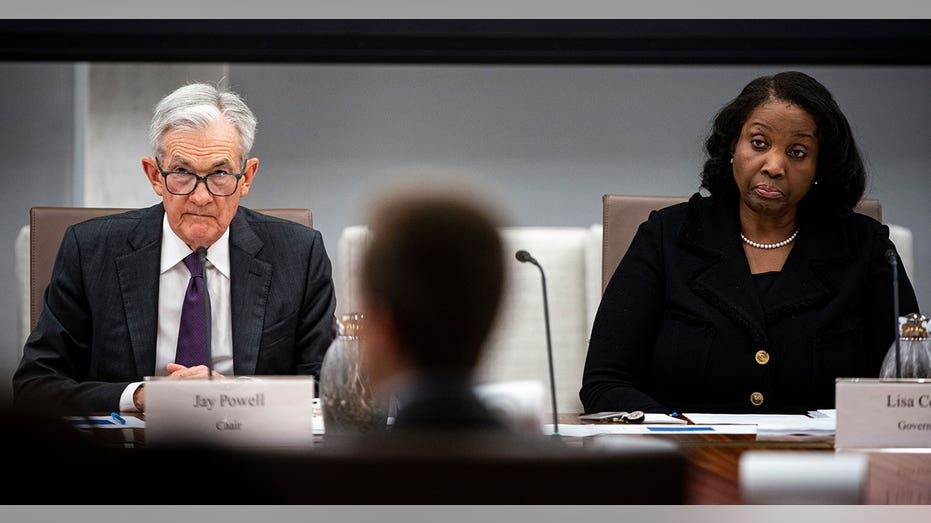 Jerome Powell and Lisa Cook sitting