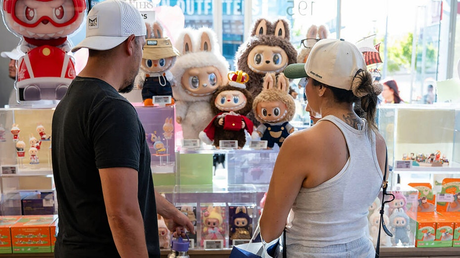 Customers look at Labubu dolls on display at Pop Mart's new store in Las Vegas on July 12, 2025.