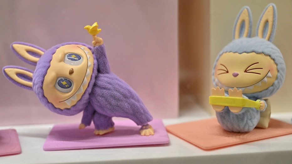This photograph shows a view of Labubu elves, collectible plush toys designed by Hong Kong illustrator Kasing Lung as part of his series "The Monsters", displayed at a Pop Mart shop in Paris on August 17, 2025. (Photo by Martin LELIEVRE / AFP) / RESTRICTED TO EDITORIAL USE - MANDATORY MENTION OF THE ARTIST UPON PUBLICATION - TO ILLUSTRATE THE EVENT AS SPECIFIED IN THE CAPTION