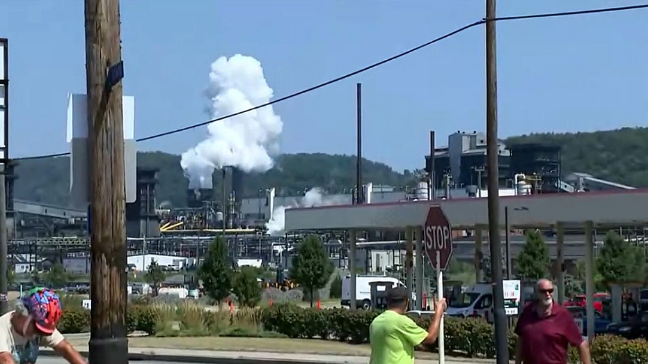 plume of smoke and steam at factory