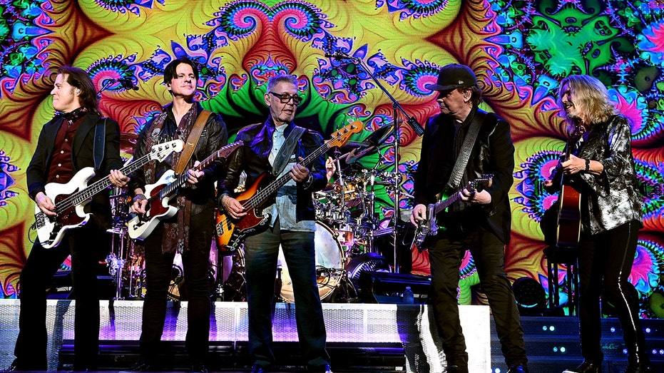 Terry Gowan, Will Evanovich, Chuck Panozzo, James "JY" Young, and Tommy Shaw of Styx perform on stage
