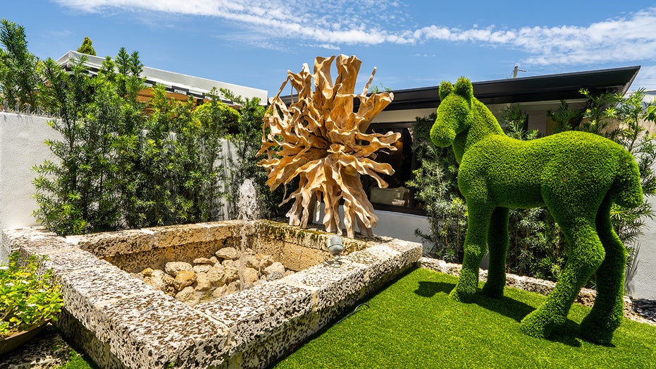 Backyard sculpture and horse topiary