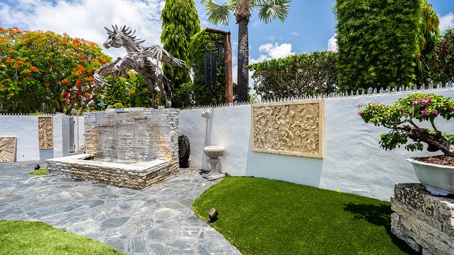 Backyard with unicorn sculpture
