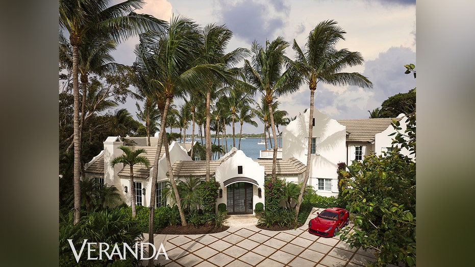 Sylvester Stallone has palm trees in the front and a large corridor.
