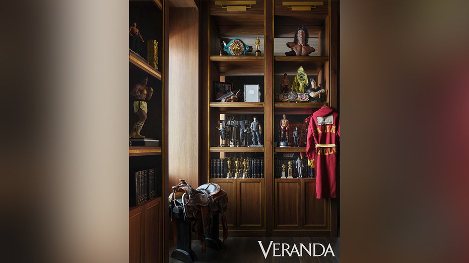 Books wardrobe with books and souvenirs from different stallone films.