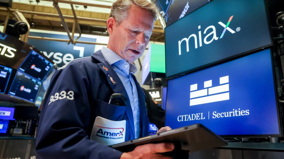 NYSE Trader as Miami International Holdings (MIAX) goes public in the company's initial public offering (IPO) on the floor of the New York Stock Exchange (NYSE) in New York, US, on Thursday, Aug. 14, 2025.