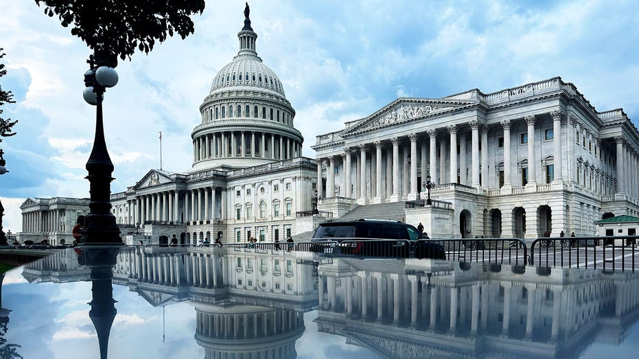 The US Capitol's reflection after a rain shower