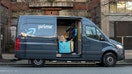 Amazon Prime Now Delivery van and driver downtown on 4th avenue late in the day. - Fox Business News