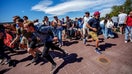OREM, UTAH - SEPTEMBER 10: People run after shots were fired during an appearance by Charlie Kirk at Utah Valley University on September 10, 2025 in Orem, Utah.  Kirk, founder of Turning Point USA, was speaking at his "American Comeback Tour" when he was shot in the neck and killed. - Fox Business News