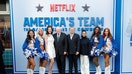 Members of the Dallas Cowboys Cheerleaders are pictured with Charlotte Jones, Jerry Jones, Ted Sarandos, and Bela Bajaria at the premiere of Netflix's "America's Team: The Gambler And His Cowboys" at The Egyptian Theatre Hollywood on August 11, 2025, in Los Angeles, California.  - Fox Business News