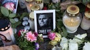 Flowers and candles are seen at a makeshift memorial for murdered American conservative activist Charlie Kirk outside the U.S. embassy as its flag hangs at half-staff on September 14, 2025 in Berlin, Germany. - Fox Business News