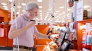 Steve Decker, Senior Manager of Accessibility at Target, and is testimg out the new self checkout machines that he helped develop.  - Fox Business News